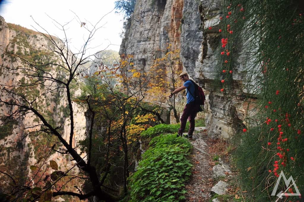 hiking trail man made cut into overhanging walls in Greece