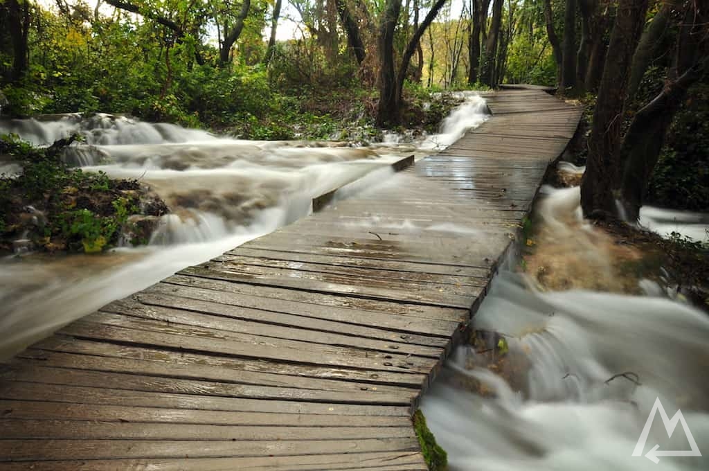 bridge with water flowing over it in Croatia