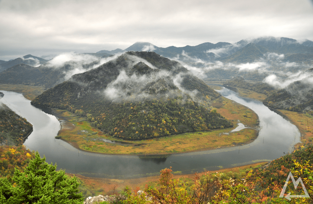 bent river around cloudy hills in Montenegro